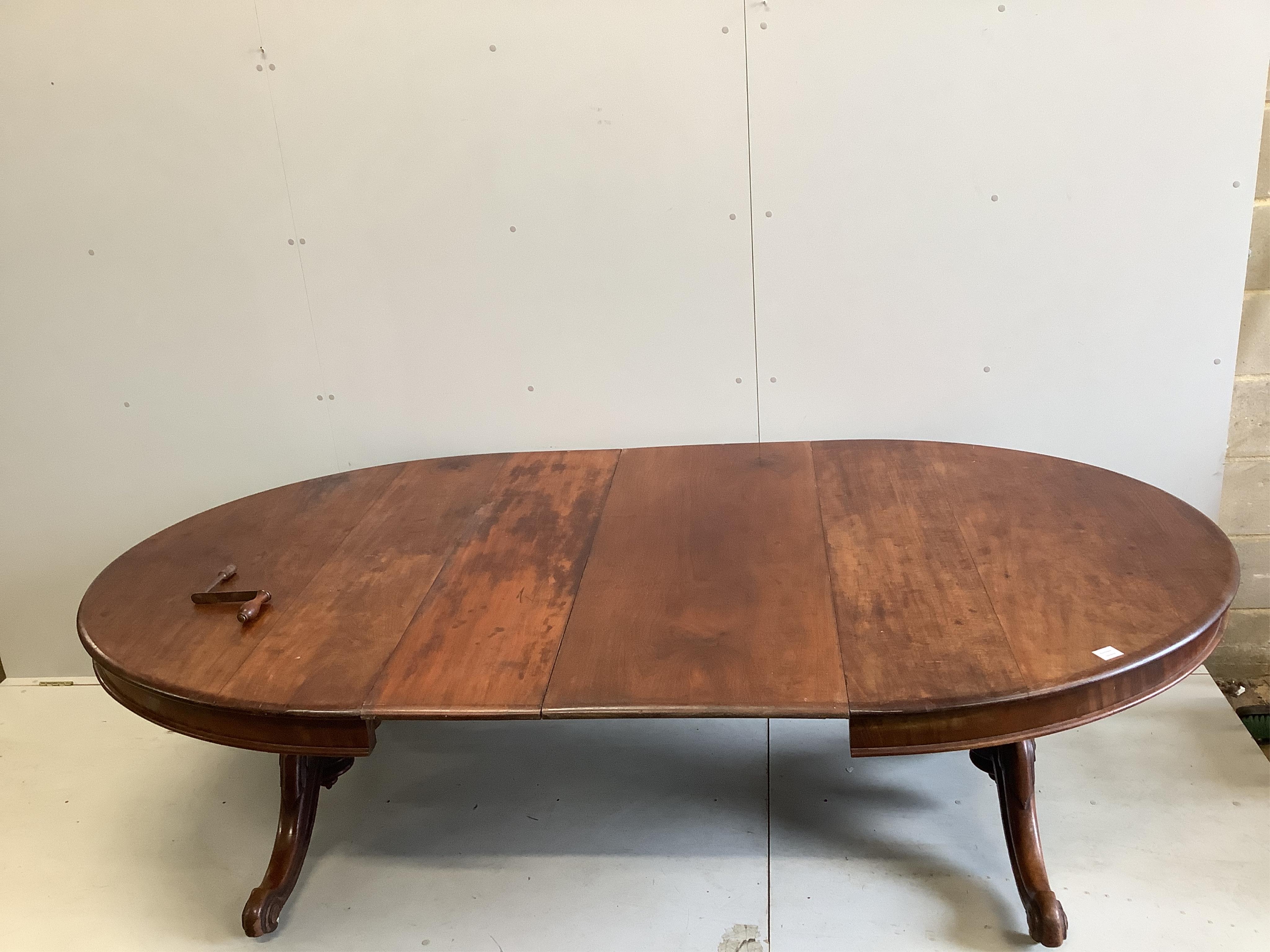 A Victorian mahogany twin pillar extending dining table, 246cm extended, two spare leaves, depth 134cm, height 71cm. Condition - fair